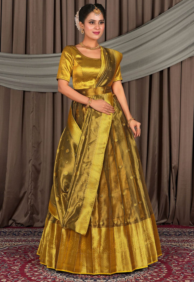 Woman wearing a gold lehenga with a matching blouse