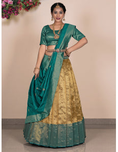 Woman wearing a traditional green and gold lehenga choli