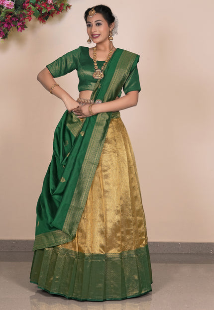 Woman wearing a green and gold traditional outfit