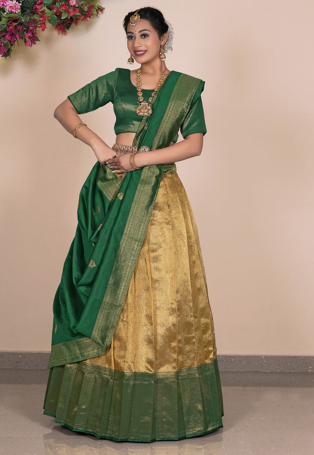 Woman wearing a green and gold traditional outfit