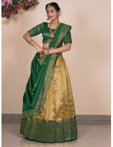 Woman wearing a green and gold traditional outfit