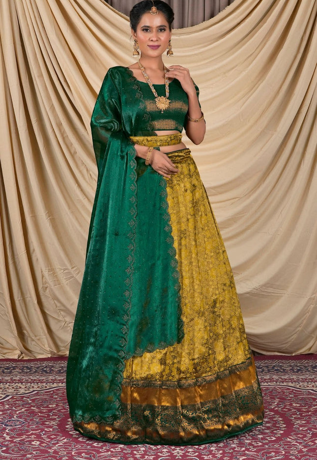 Woman wearing a green and yellow traditional lehenga choli with dupatta