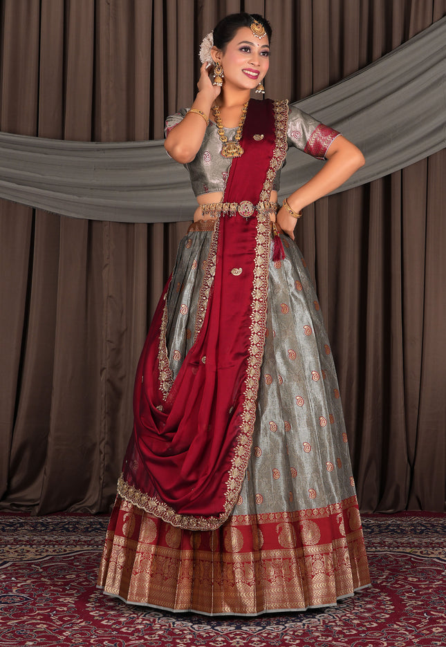 Woman in traditional red and gray lehenga choli