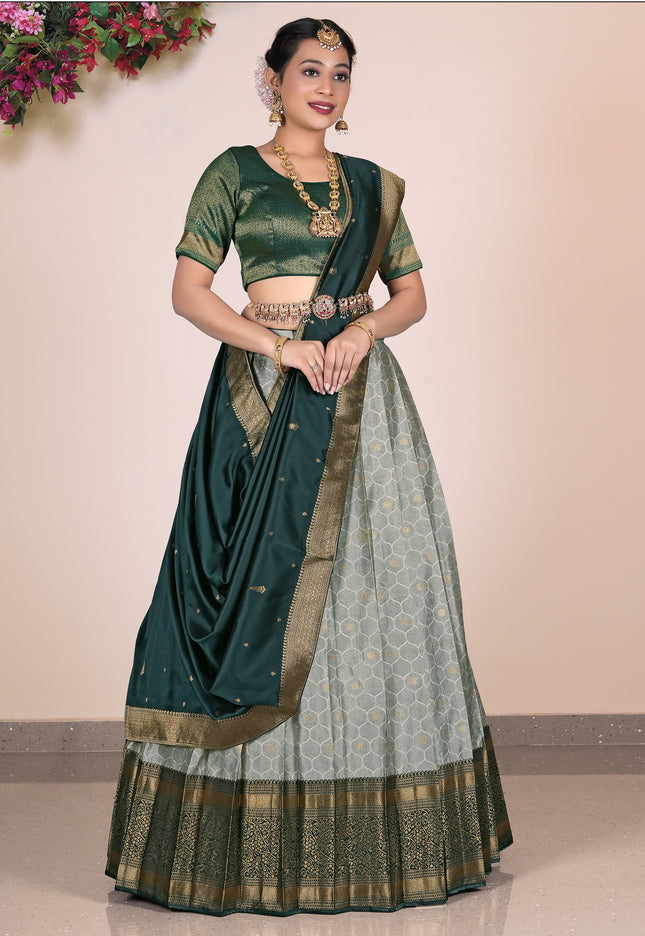 Woman wearing a Gray Lehenga with a green blouse