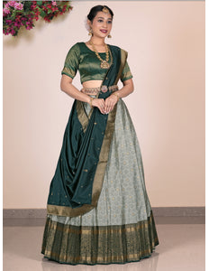 Woman wearing a Gray Lehenga with a green blouse