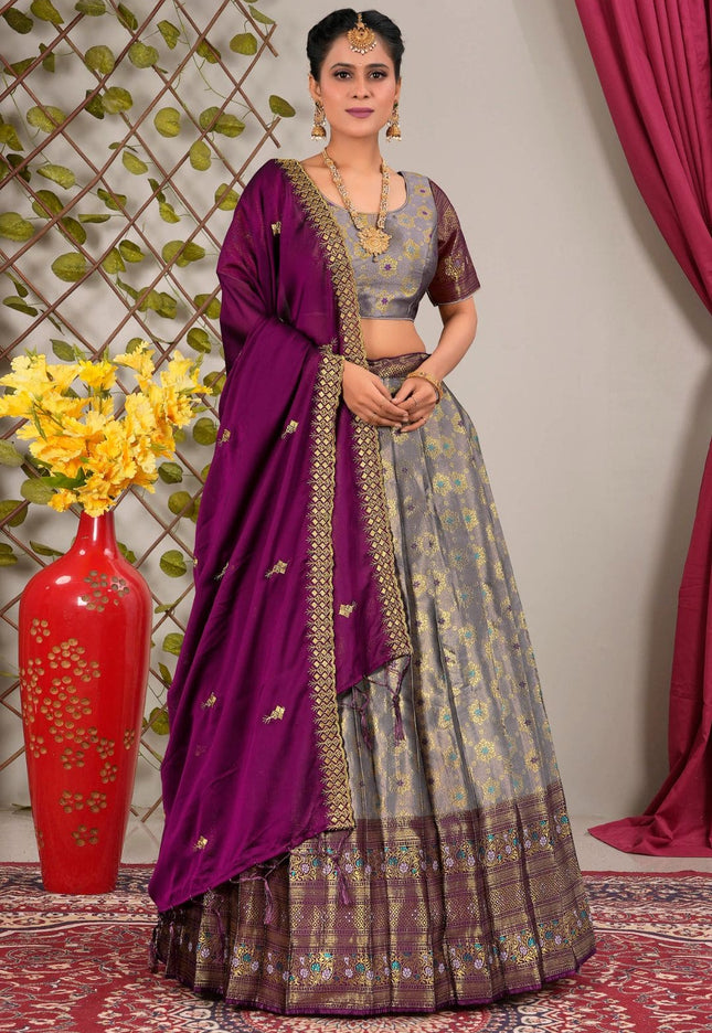 Woman wearing a traditional outfit with a purple dupatta