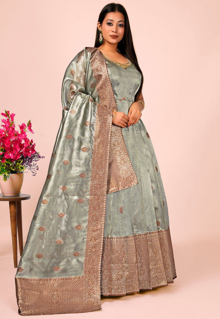 Woman wearing a traditional gray gown with dupatta