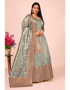 Woman wearing a traditional gray gown with dupatta