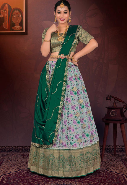 Woman in a traditional gray and floral lehenga choli