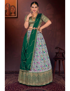 Woman in a traditional gray and floral lehenga choli