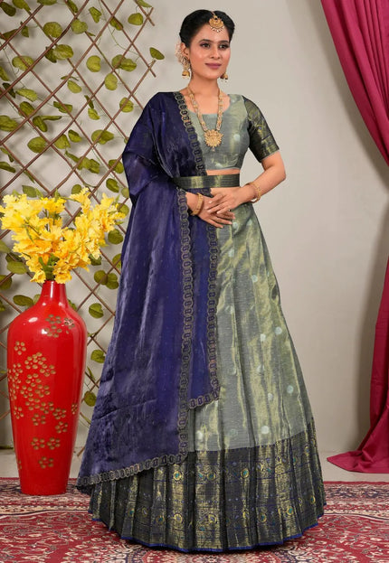 Woman in traditional blue and gray lehenga choli with dupatta