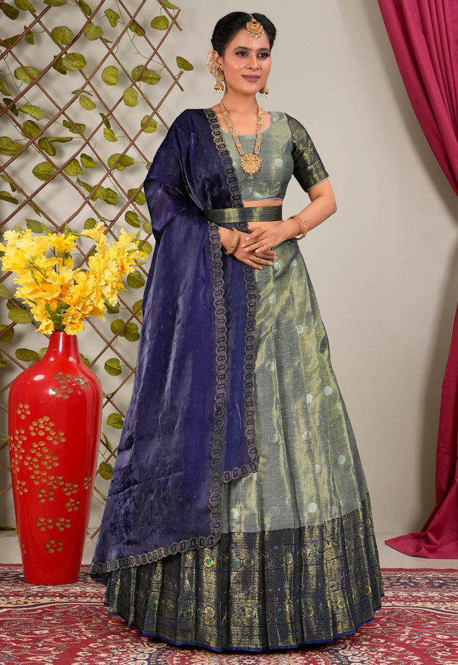 Woman in traditional blue and gray lehenga choli with dupatta