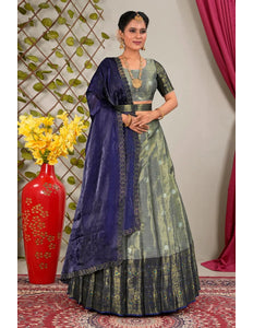 Woman in traditional blue and gray lehenga choli with dupatta