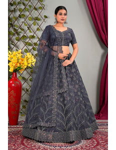 Woman wearing a dark gray embroidered lehenga