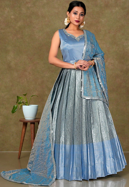 Woman in a blue and gray traditional gown with dupatta