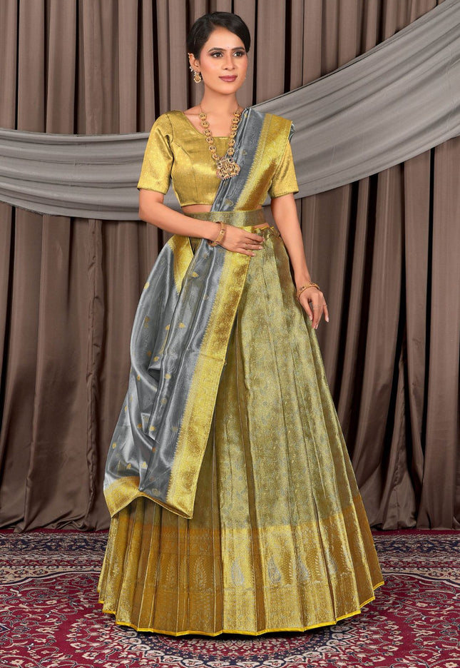 Woman wearing a traditional gray lehenga choli with dupatta