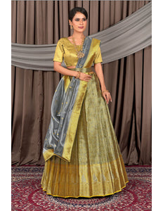 Woman wearing a traditional gray lehenga choli with dupatta