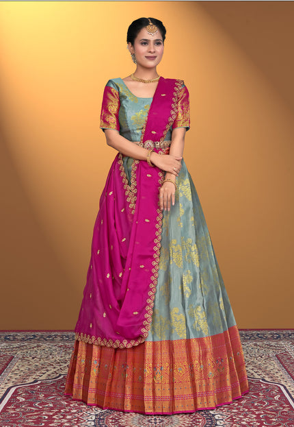 Woman wearing a traditional Gray and Pink Lehenga Choli