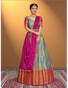 Woman wearing a traditional Gray and Pink Lehenga Choli