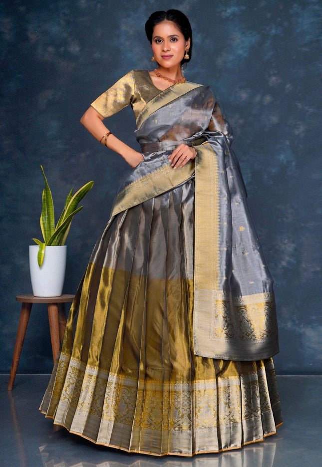 Woman wearing a traditional gray lehenga choli with dupatta