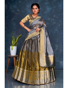 Woman wearing a traditional gray lehenga choli with dupatta