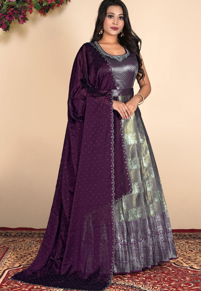 Woman wearing a purple and silver traditional outfit