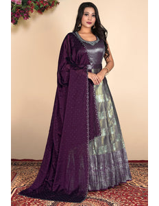 Woman wearing a purple and silver traditional outfit