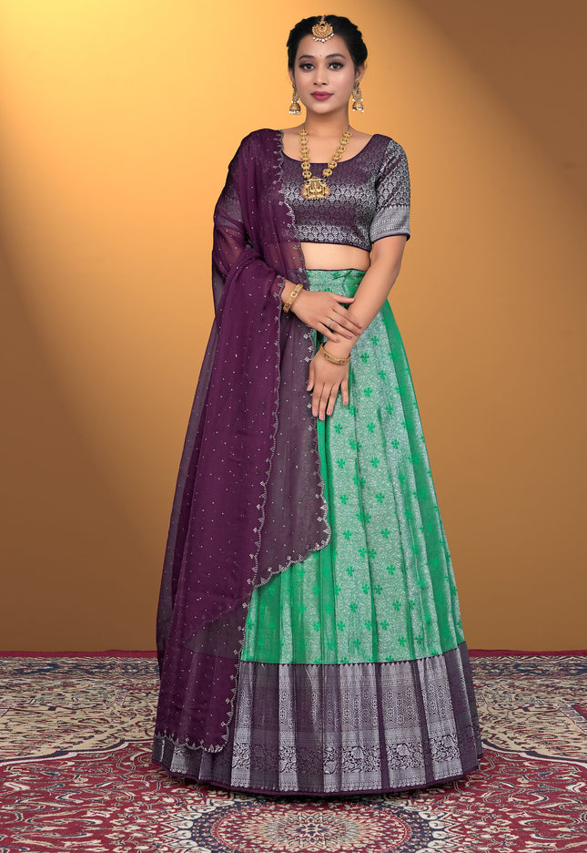 Woman wearing a green and purple traditional outfit
