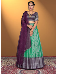 Woman wearing a green and purple traditional outfit