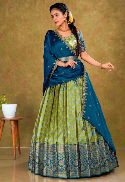 Woman in a blue and green traditional lehenga choli with dupatta