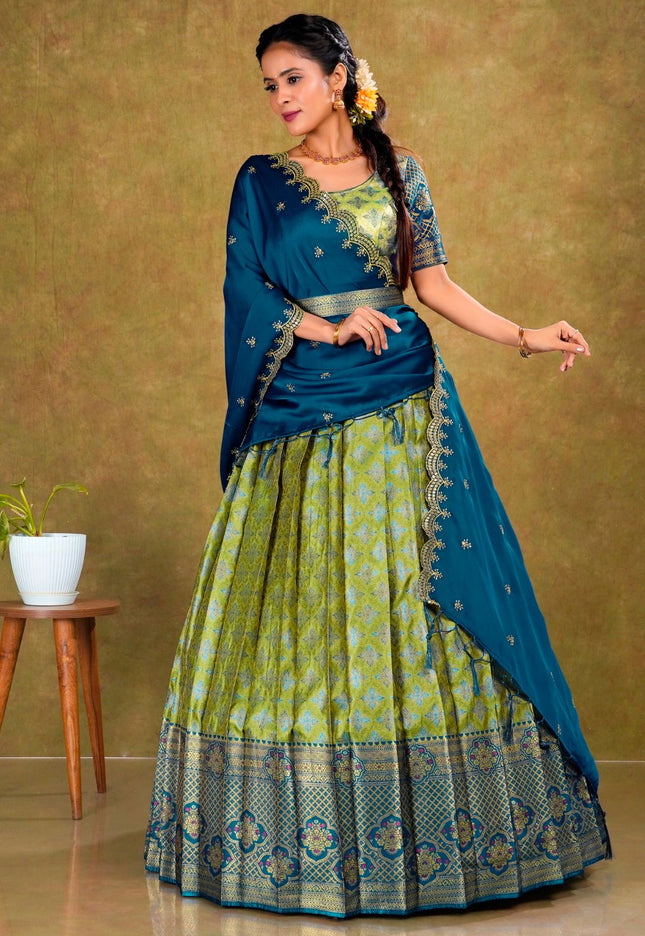 Woman in a blue and green traditional lehenga choli with dupatta