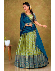 Woman in a blue and green traditional lehenga choli with dupatta