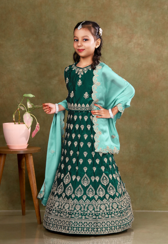 Young girl in a green-coloured kids' readymade lehenga
