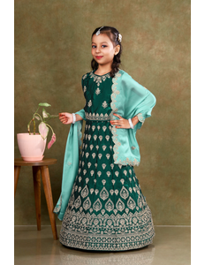 Young girl in a green-coloured kids' readymade lehenga