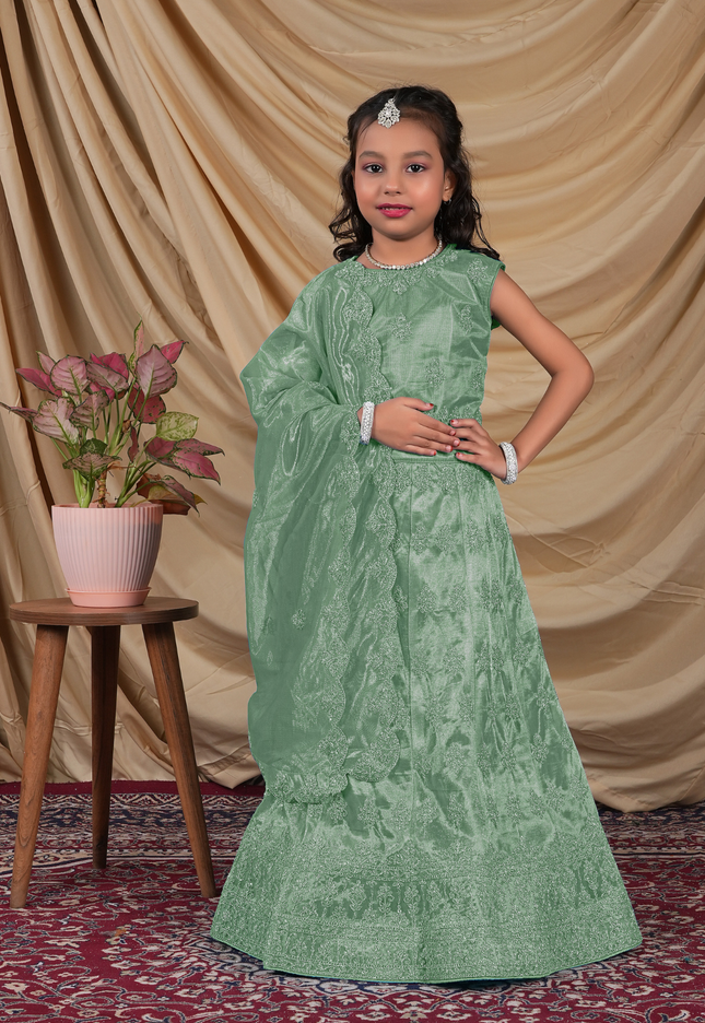 Young girl in a green-coloured kids' readymade lehenga choli