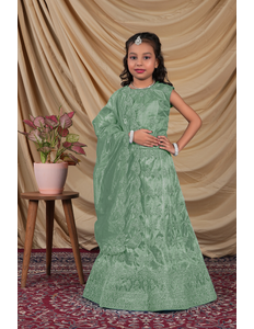 Young girl in a green-coloured kids' readymade lehenga choli