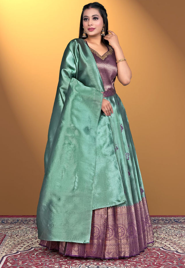 Woman wearing a green and purple traditional outfit