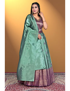 Woman wearing a green and purple traditional outfit