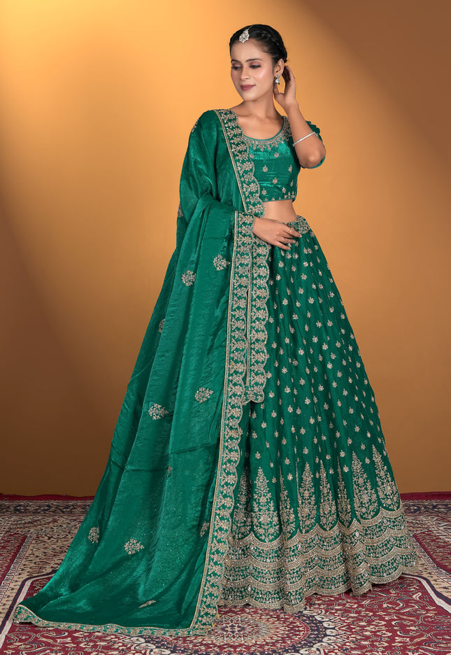 Green embroidered traditional lehenga with matching blouse and dupatta