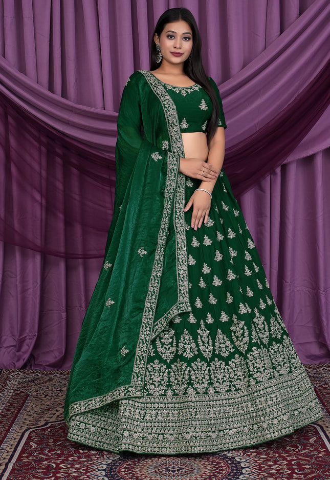 Woman wearing a green embroidered lehenga choli