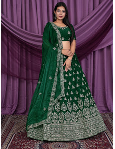 Woman wearing a green embroidered lehenga choli