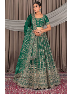 Woman wearing a green embroidered traditional outfit