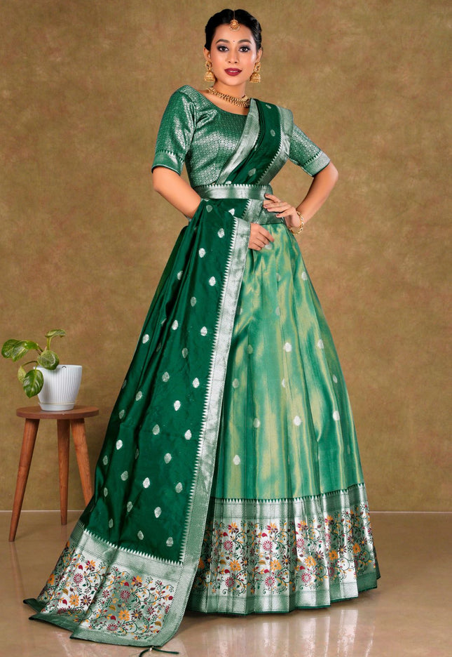 Woman wearing a green lehenga choli with a patterned border