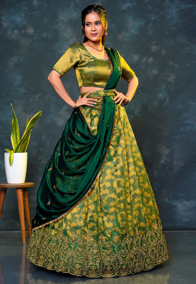 Woman in a green traditional lehenga choli with dupatta