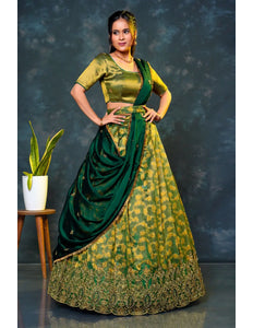 Woman in a green traditional lehenga choli with dupatta