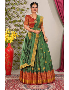 Woman wearing a green and Red lehenga choli with dupatta