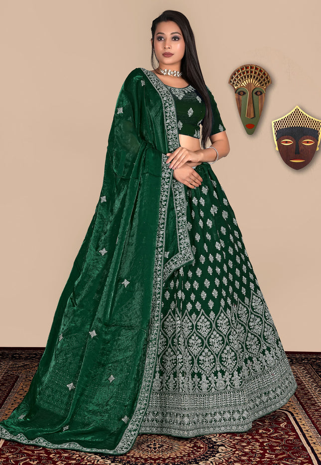 Woman wearing a green embroidered lehenga choli