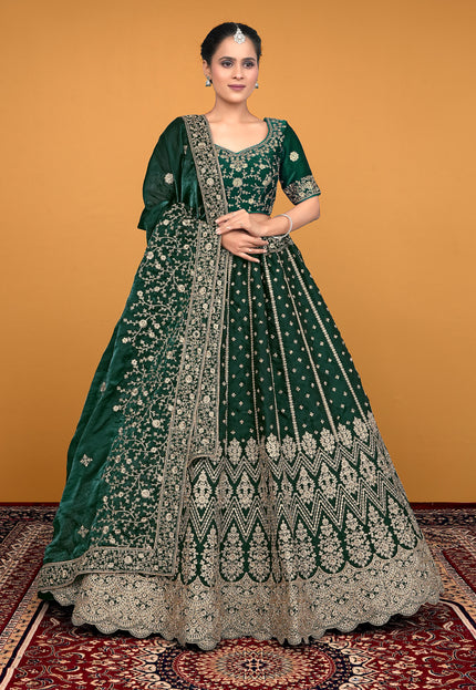Woman wearing a green embroidered traditional lehenga choli