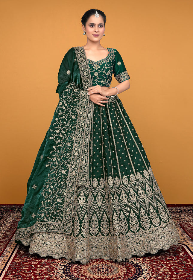 Woman wearing a green embroidered traditional lehenga choli