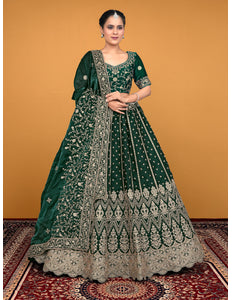 Woman wearing a green embroidered traditional lehenga choli